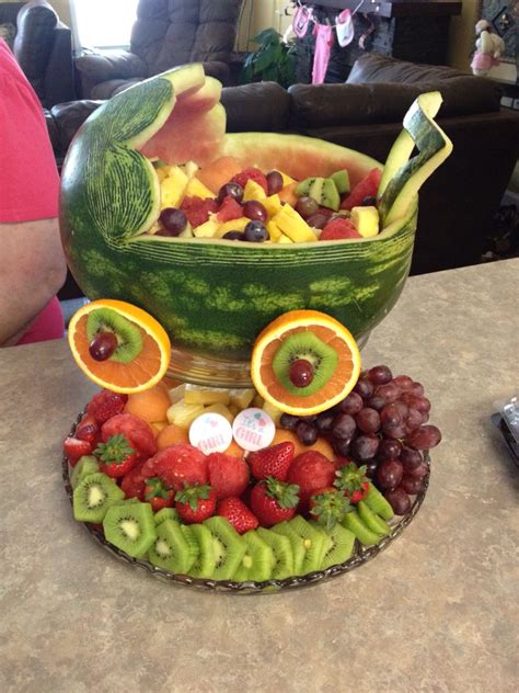 It takes a bit of time to carve it, but the bowl can be carved before the party, wrapped in plastic and refrigerated. Watermelon Baby Carriage | Présentation fruits, Fruits et ...