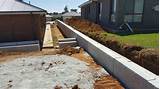 A cinder block retaining wall needs a poured concrete or gravel foundation, footings, and grout filling and rebar for support. Precast Retaining Walls Geelong - Otway Precast