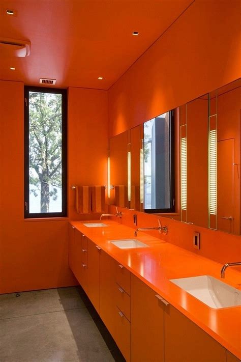 7 Bathrooms That Make A Statement With Bold Colors Orange Bathrooms Orange Rooms Orange