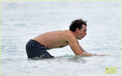 Isla Fisher Wears Pink Bathing Suit During Beach Day With Sacha Baron Cohen In Barbados Photo