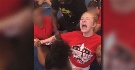 disturbing videos show high school cheerleaders forced into splits cbs news