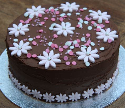 Small flower arrangements are very attractive and offer a great way to personalize cake decoration. Chocolate and Pink Flower Birthday Cake - lovinghomemade