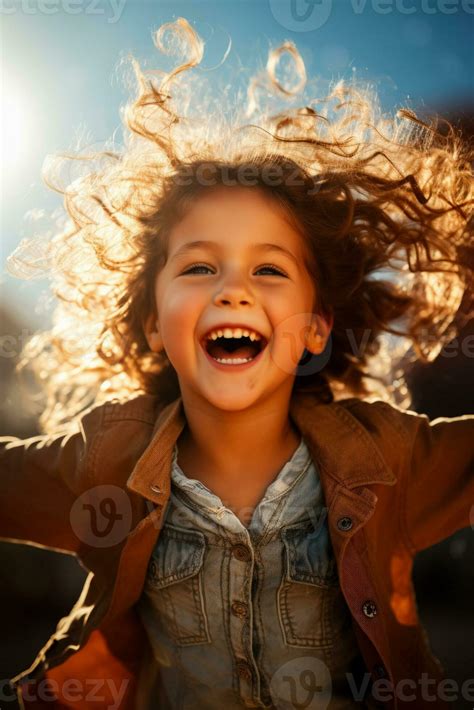 A Joyful Child Spinning With Arms Wide Open Isolated On A Sunny