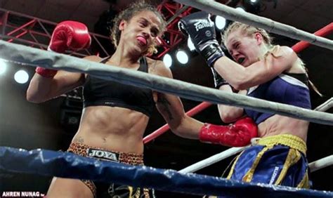 Two Women Boxing In An Indoor Ring