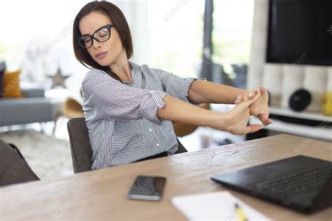 tired businesswoman stretching stock image f028 9824 science photo library