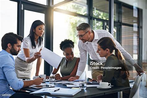 Exchanging Ideas In The Boardroom Stock Photo Download Image Now