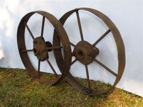 Set Of Two Antique Cast Iron Wheels From A Farm Wagon Or Implement