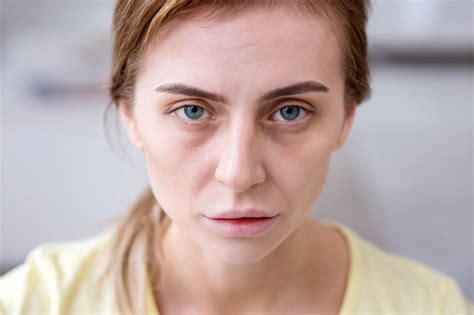 Premium Photo Weary Face Portrait Of A Pale Exhausted Woman Looking