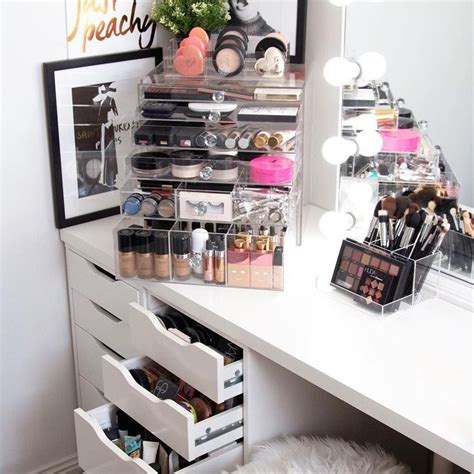 a vanity with makeup and other items on it