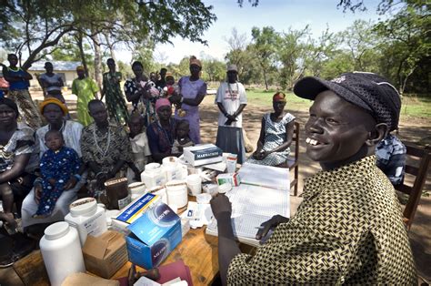 A Community Health Worker Distributes Medicine To A Rural Community In South Sudan Community