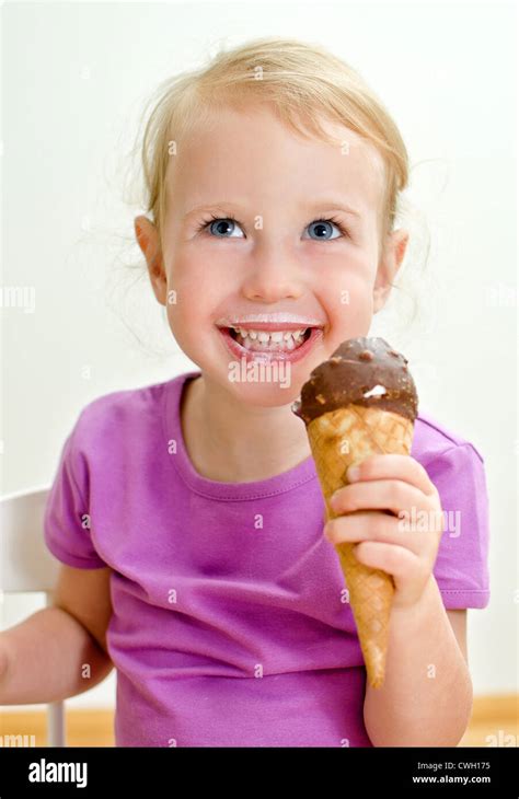 Cute Little Girl Eating Ice Cream Stock Photo Alamy