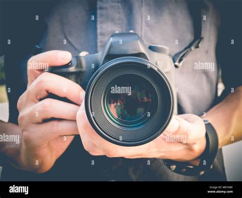 Photographer Holding Dslr Camera Stock Photo Alamy