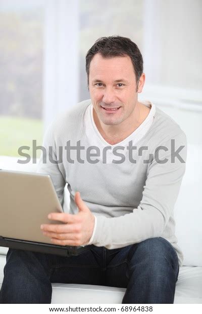 Man Sitting Couch Using Laptop Computer Stock Photo 68964838 Shutterstock