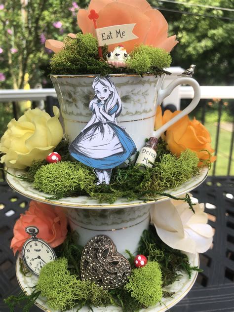 alice in wonderland mad hatter tea party centerpiece stacked tea cups floating tea cups