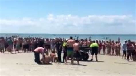 ‘sex on the beach video teens arrested for alleged romping while crowd cheers the courier mail