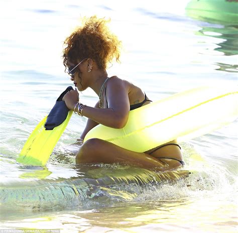 rihanna shows off her beach body in cut out bikini in barbados daily mail online