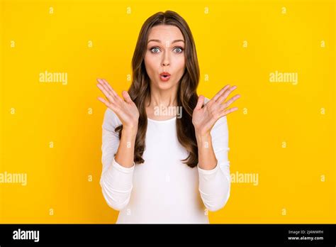 Photo Of Shocked Crazy Lady Raise Palms Omg Face Reaction Wear White Shirt Isolated Yellow Color