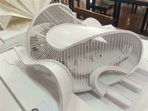 An Architectural Design Memaar Is Displayed On A Table In Front Of
