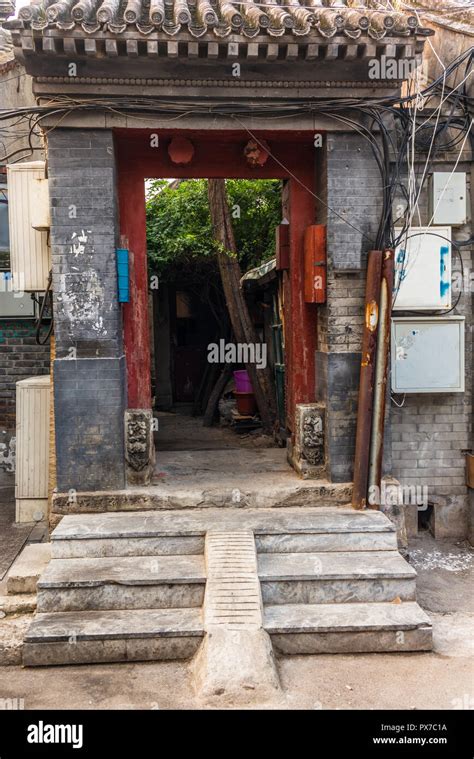 A View Of An Entrance Of A Courtyard In A Traditional Beijing Hutong In