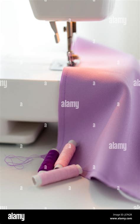 Sewing Machine Spools Of Thread And Fabric Stock Photo Alamy