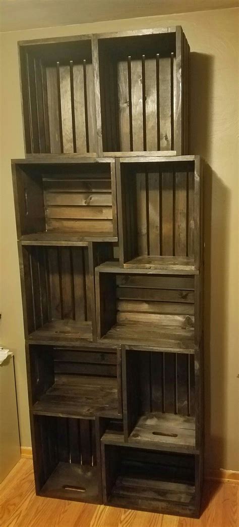 Premade wooden crates aren't your only option for diy shelves and pallet wood can often be reclaimed and mixed with crates to add interest. wooden crate storage (With images) | Crate bookshelf ...