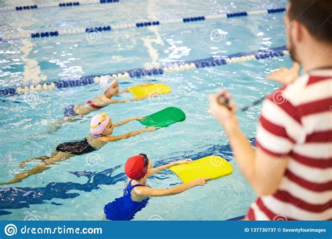 Little Swimmers Training With Instructor Stock Image Image Of Water