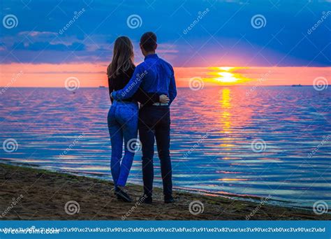 Couple In Love At Sunset By The Sea Stock Photo Image Of Female