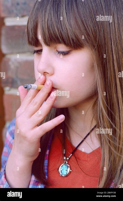 Young Teenager Starting To Smoke Smoking A Cigarette Cigaret Stock
