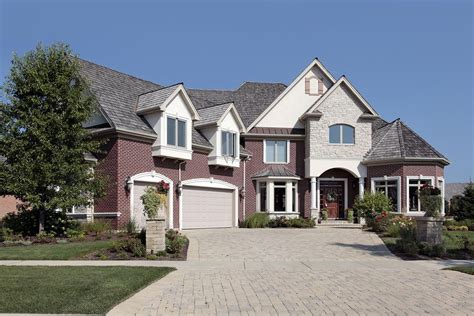 Multilevel Suburban Brick House With Spacious Brick Driveway And Double