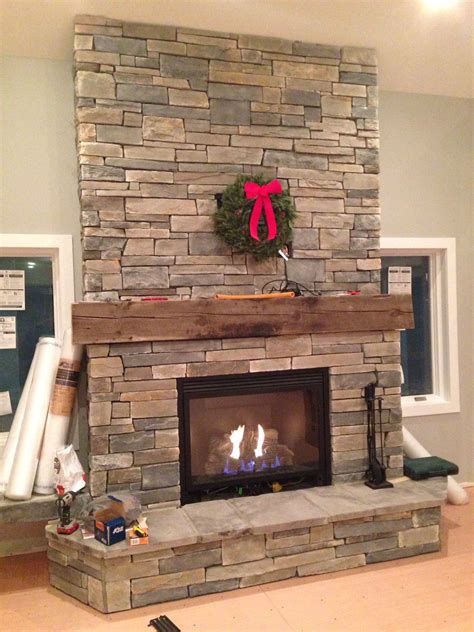 Hand Designed Fireplace With Ledge Stone And 100 Year Old Barn Beam