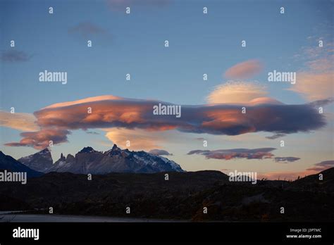 Lenticular Clouds At Dusk Over The Mountains Of Torres Del Paine