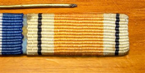 Unidentified Ribbon On Ribbon Bar With Dfc Great Britain Orders