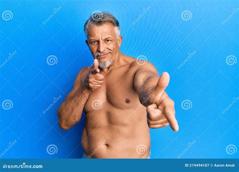 Middle Age Grey Haired Man Standing Shirtless Pointing Fingers To Camera With Happy And Funny