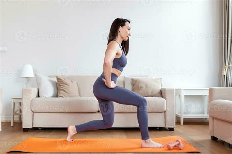 Home Workout Woman Doing Aerobics Warming Up For Flexibility Leg Stretching Exercises For