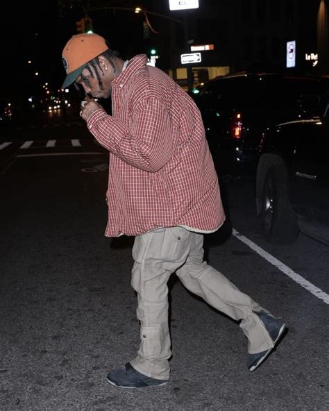 Travis Scott Steps Out In Nyc Wearing Vetements Shirt Jacket And Kaws X