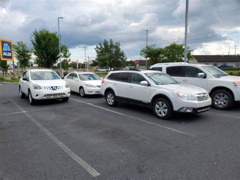 4 White Cars Parked Together At The Grocery Store Rmildlyinteresting