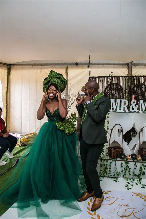 sotho wedding with the bride in green seshweshwe south african wedding blog south african