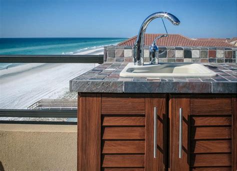 The full width integrated sink, shows the expertise of the artisans making these cabinets, hand finishing the 7″ deep sink to perfection. NatureKast PVC Outdoor Cabinets | Affordable Outdoor Kitchens