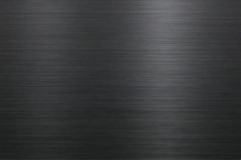 A Black Metal Texture Background That Looks Like It Has Been Brushed