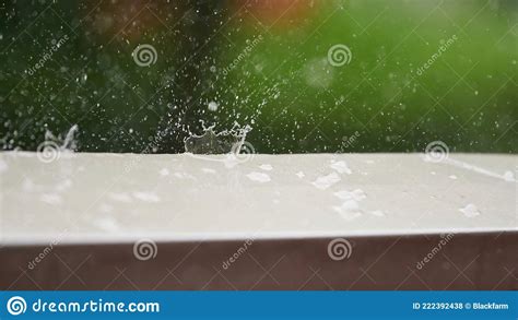 Detail Of Hail Falling On The Stone Ledge Of A Terrace During A Heavy