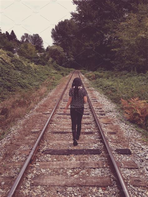 Girl Walking On Train Tracks ~ People Photos ~ Creative Market