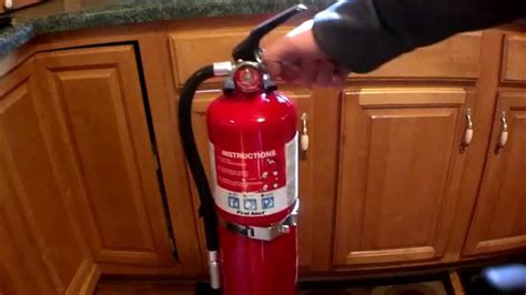 The way to fight a fire in the soyuz is. How To Install a Kitchen Fire Extinguisher - YouTube