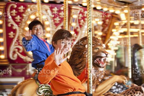 Boys Riding Carousel Stock Photo Download Image Now Carousel Child