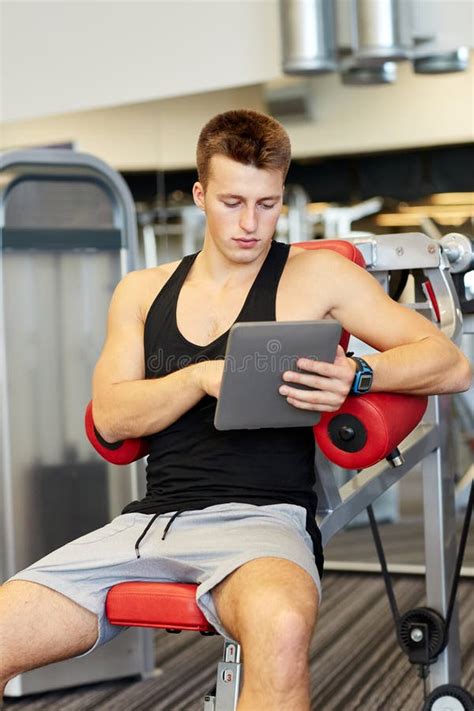 Young Man With Tablet Pc Computer In Gym Stock Image Image Of Male