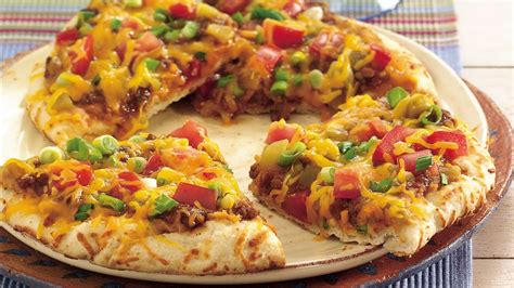 Of course, i finished them off with lots and lots of cheese! Easy Grilled Nacho Pizzas recipe from Pillsbury.com