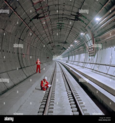 Monitoring Engineers Examine A Completed Section Of Channel Tunnel Rail