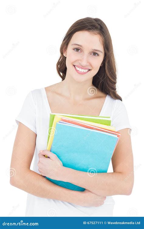 Portrait Of Cheerful Female College Student Holding Books Stock Image