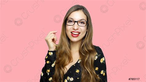 Smiling Brunette Woman In Eyeglasses Posing With Crossed Arms And