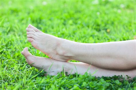 Barefooted Attractive Female Feet On Green Grass Stock Photography
