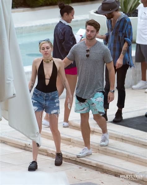 Miley Cyrus At A Pool In Miami With Her Boyfriend December 2014